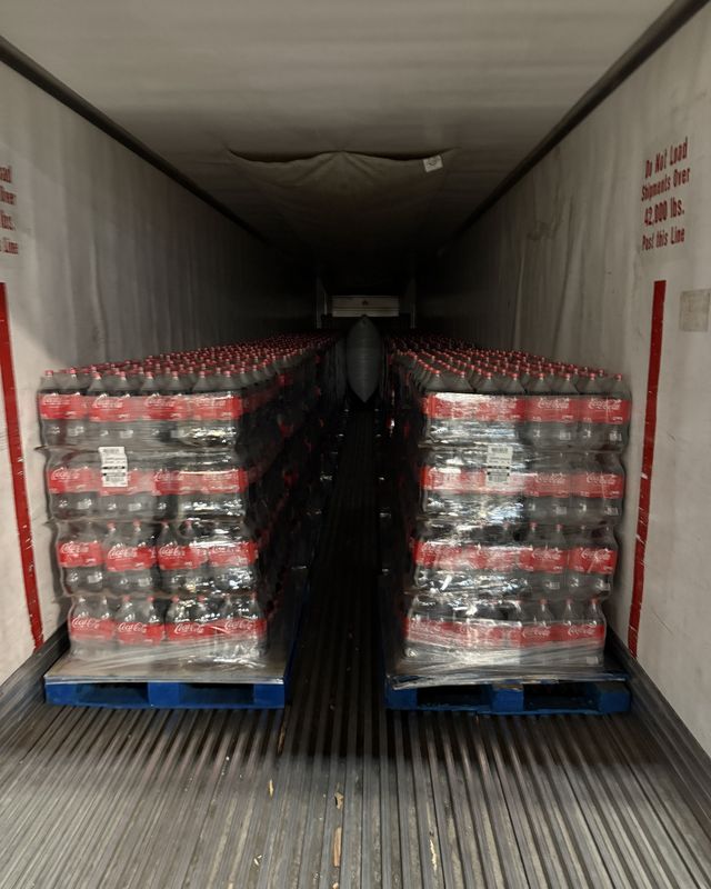 Two pallets loaded tight against the nose of a trailer